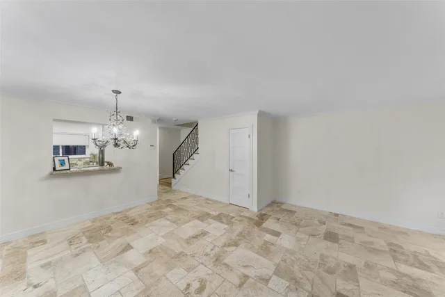 a view of a room with a large window