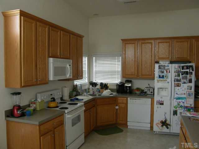 8 Drye Lane Durham, NC 27713 - Photo 5 of 9 a kitchen with a sink stove and cabinets