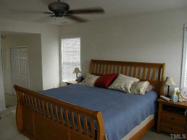8 Drye Lane Durham, NC 27713 - Photo 9 of 9 a bedroom with a bed and window