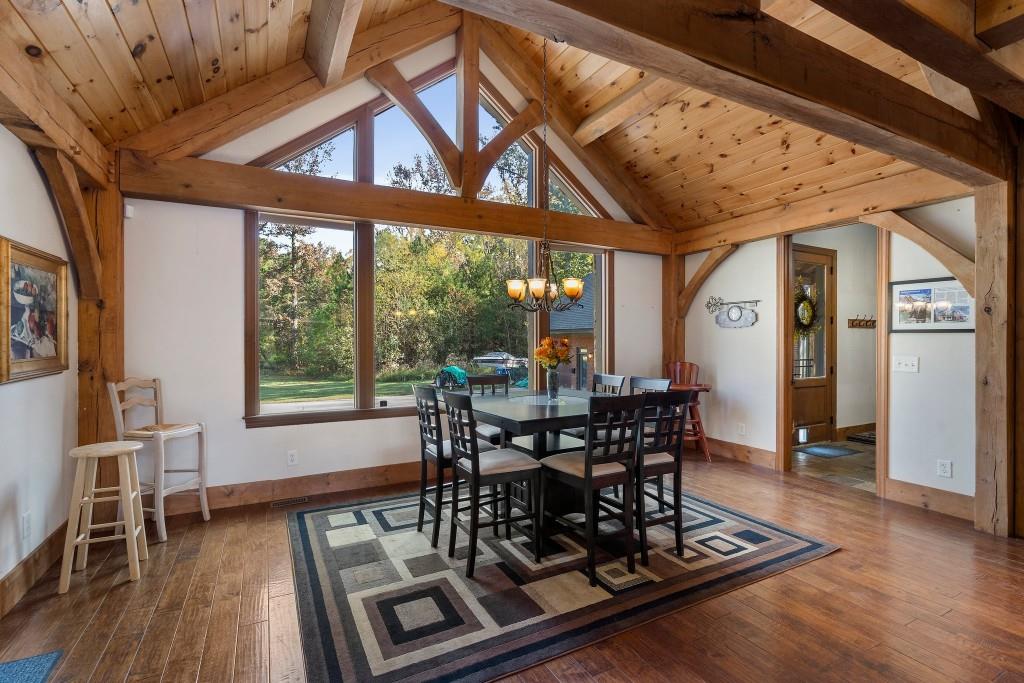5185 Buice Road Alpharetta, GA 30022 - Photo 11 of 32 a view of a dining room with furniture window and wooden floor
