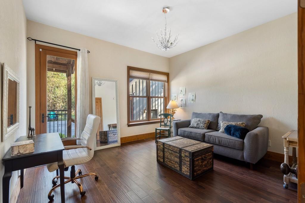 5185 Buice Road Alpharetta, GA 30022 - Photo 18 of 32 a living room with furniture and wooden floor