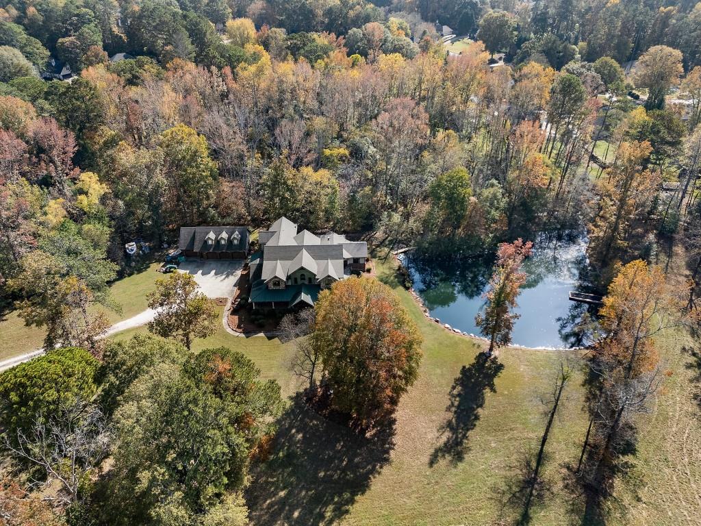 5185 Buice Road Alpharetta, GA 30022 - Photo 2 of 32 a view of a lake in between two and trees
