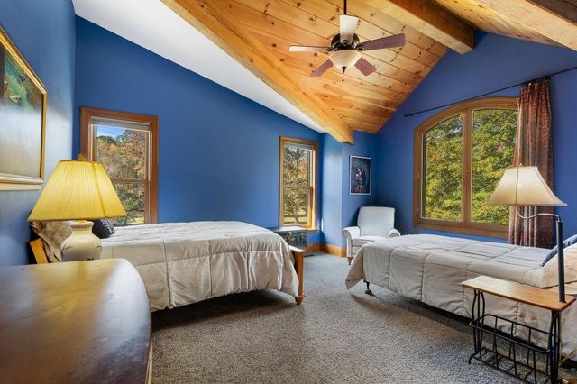 a bedroom with bed and window