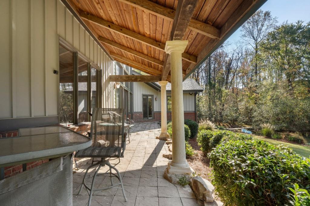 5185 Buice Road Alpharetta, GA 30022 - Photo 27 of 32 a view of patio with table and chairs and potted plants