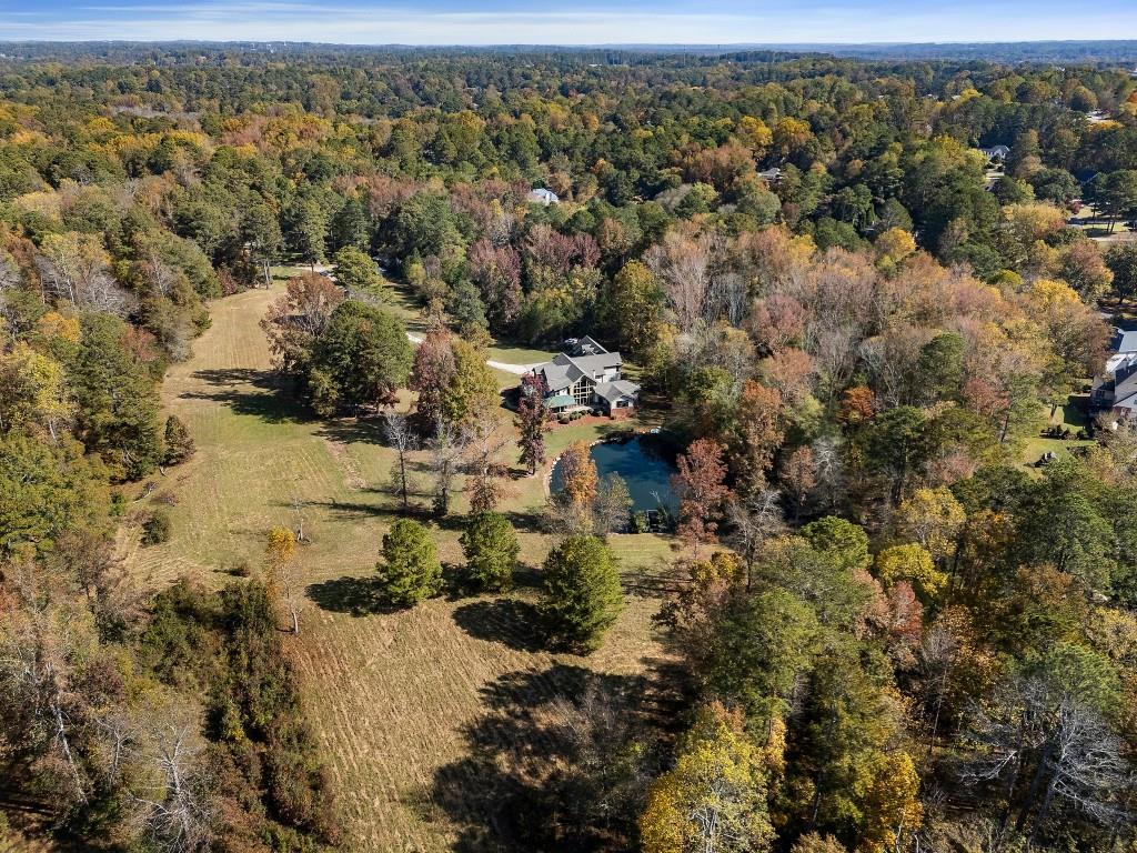 5185 Buice Road Alpharetta, GA 30022 - Photo 29 of 32 an aerial view of residential house with parking space
