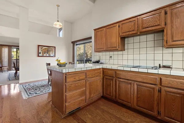 a kitchen with stainless steel appliances granite countertop a sink dishwasher stove and cabinets