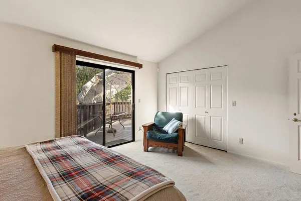 a bedroom with furniture and a window