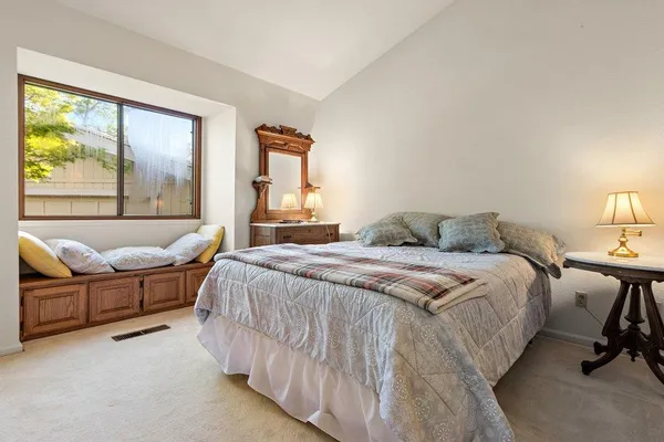 a bed room with a bed and a couch