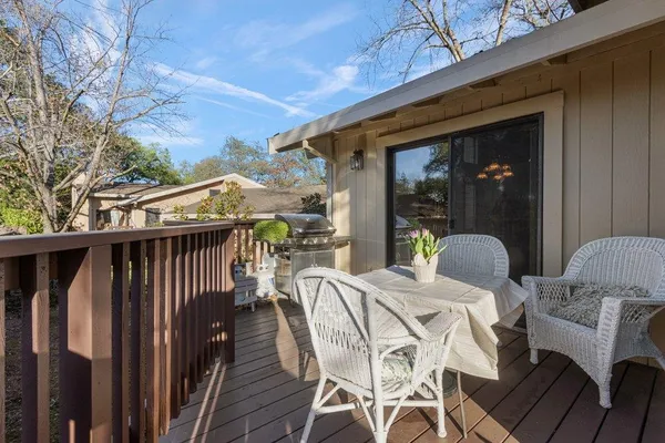 a view of a patio with a table and chairs