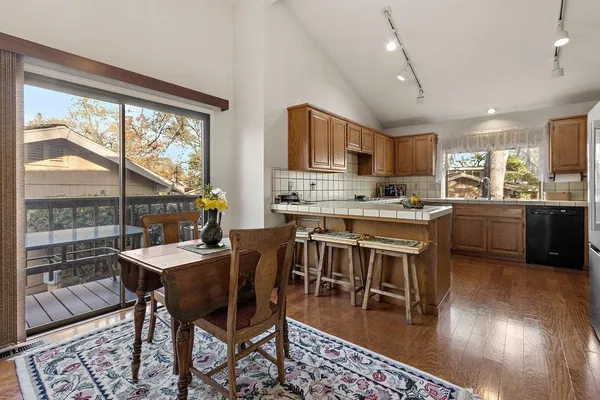a view of a dining room with furniture window and wooden floor
