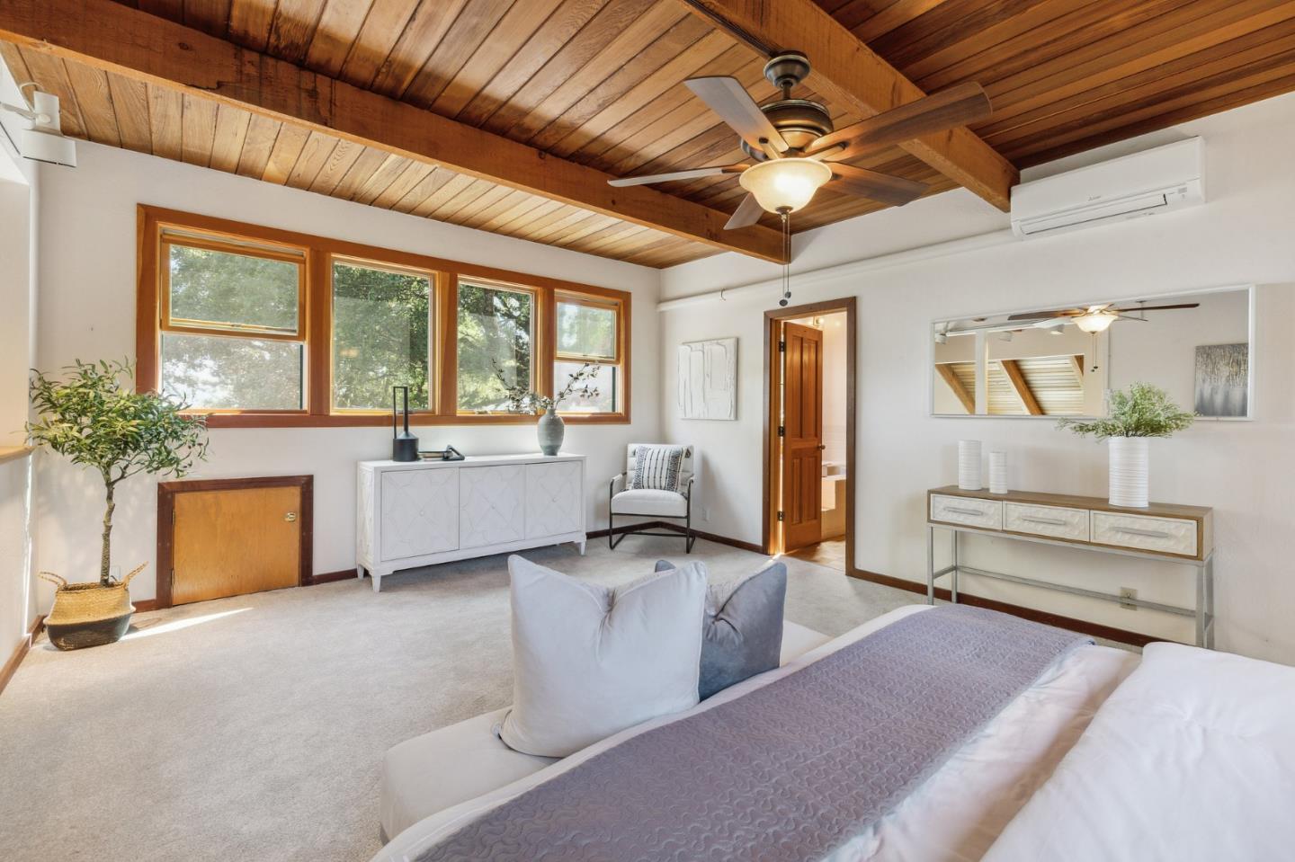 22114 Miller Ridge Road Los Gatos, CA 95033 - Photo 41 of 100 a living room with furniture a chandelier and a large window