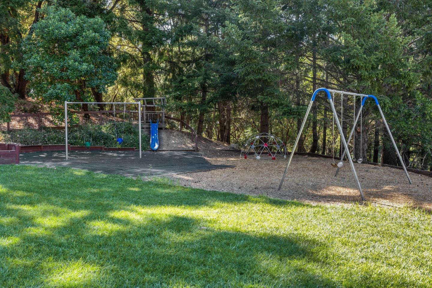 22114 Miller Ridge Road Los Gatos, CA 95033 - Photo 100 of 100 a view of a backyard with a slide