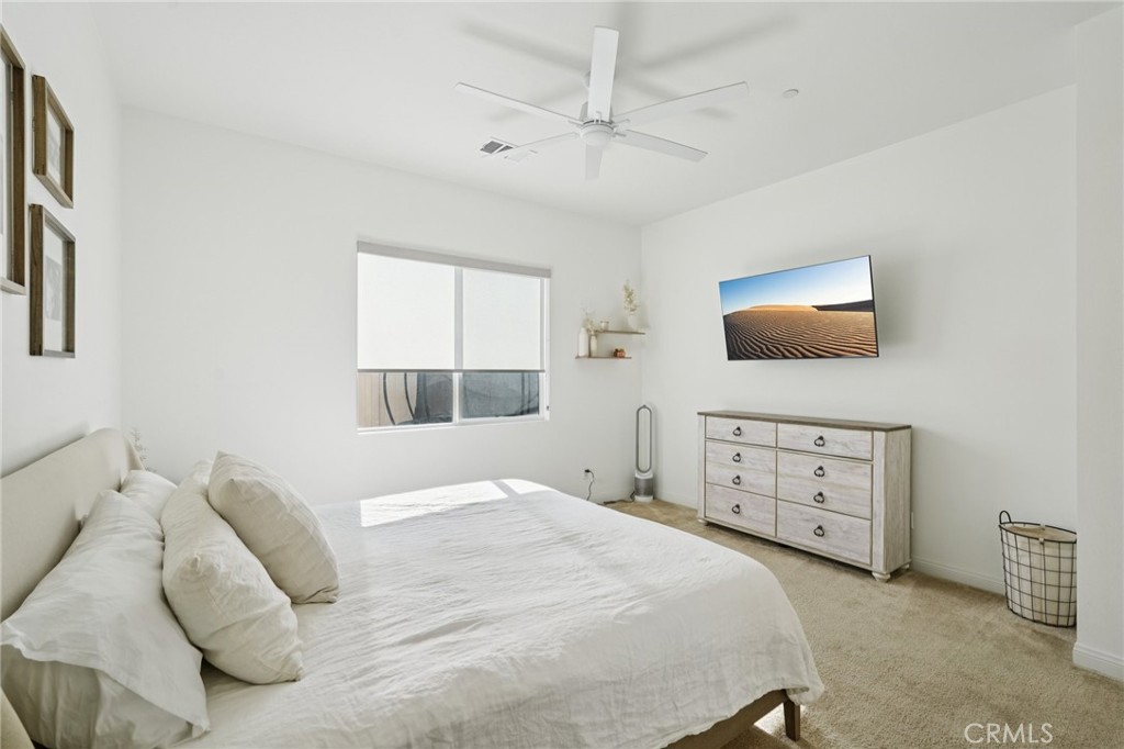 39481 Chamise Temecula, CA 92591 - Photo 11 of 34 a bedroom with a bed a window and a dresser
