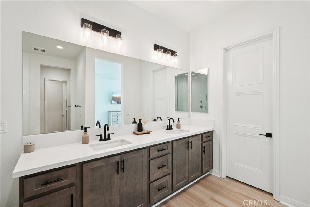 39481 Chamise Temecula, CA 92591 - Photo 13 of 34 a bathroom with double sink and mirror