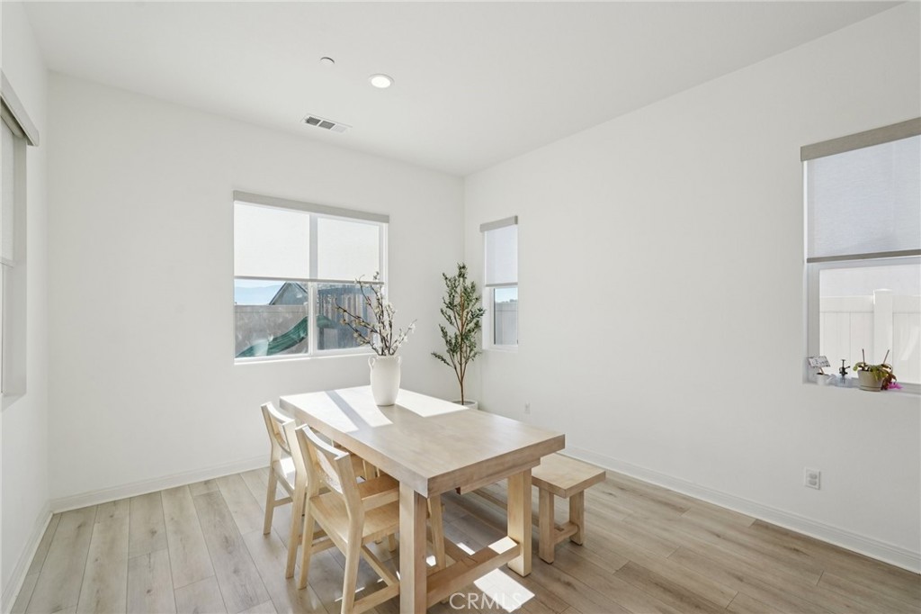 39481 Chamise Temecula, CA 92591 - Photo 5 of 34 a view of a dining room with furniture and wooden floor