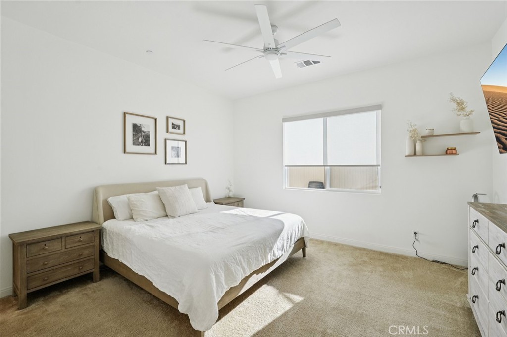 39481 Chamise Temecula, CA 92591 - Photo 9 of 34 a bedroom with a bed and a window