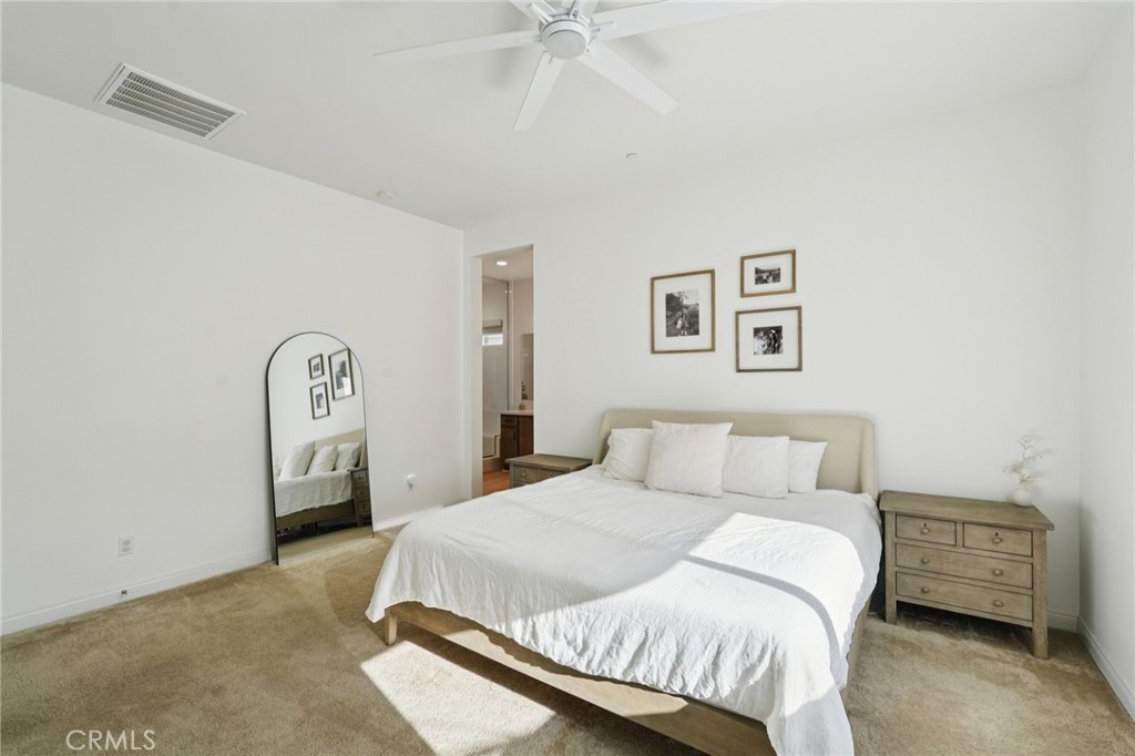 39481 Chamise Temecula, CA 92591 - Photo 10 of 34 a bedroom with a bed and a chandelier