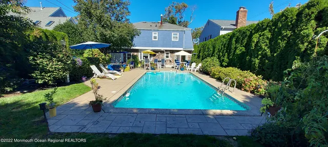 a aerial view of a house with a yard