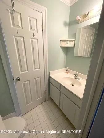 a bathroom with a sink a mirror and a shower
