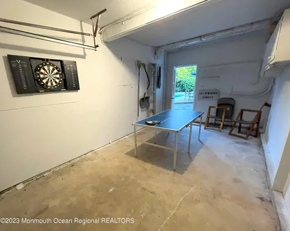 a view of a livingroom with furniture and a window