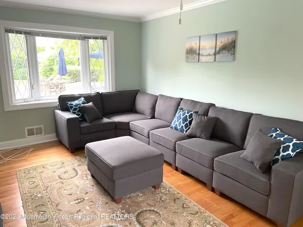 a living room with furniture and a window