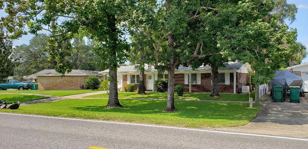 311 Pelham Road Fort Walton Beach, FL 32547 - Photo 2 of 22 Front of House and Trees