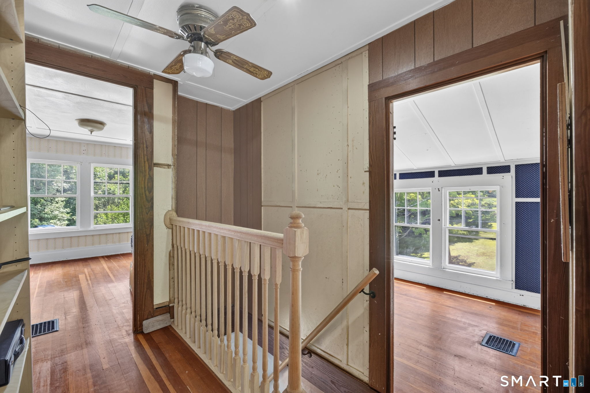 79 River Street Deep River, CT 06417 - Photo 26 of 40 a view of a hallway with wooden floor and windows