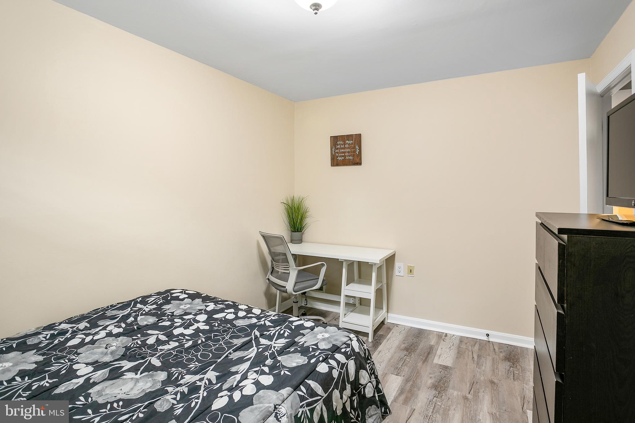 508 Fillmore Street Herndon, VA 20170 - Photo 28 of 39 a bedroom with a bed and a chair