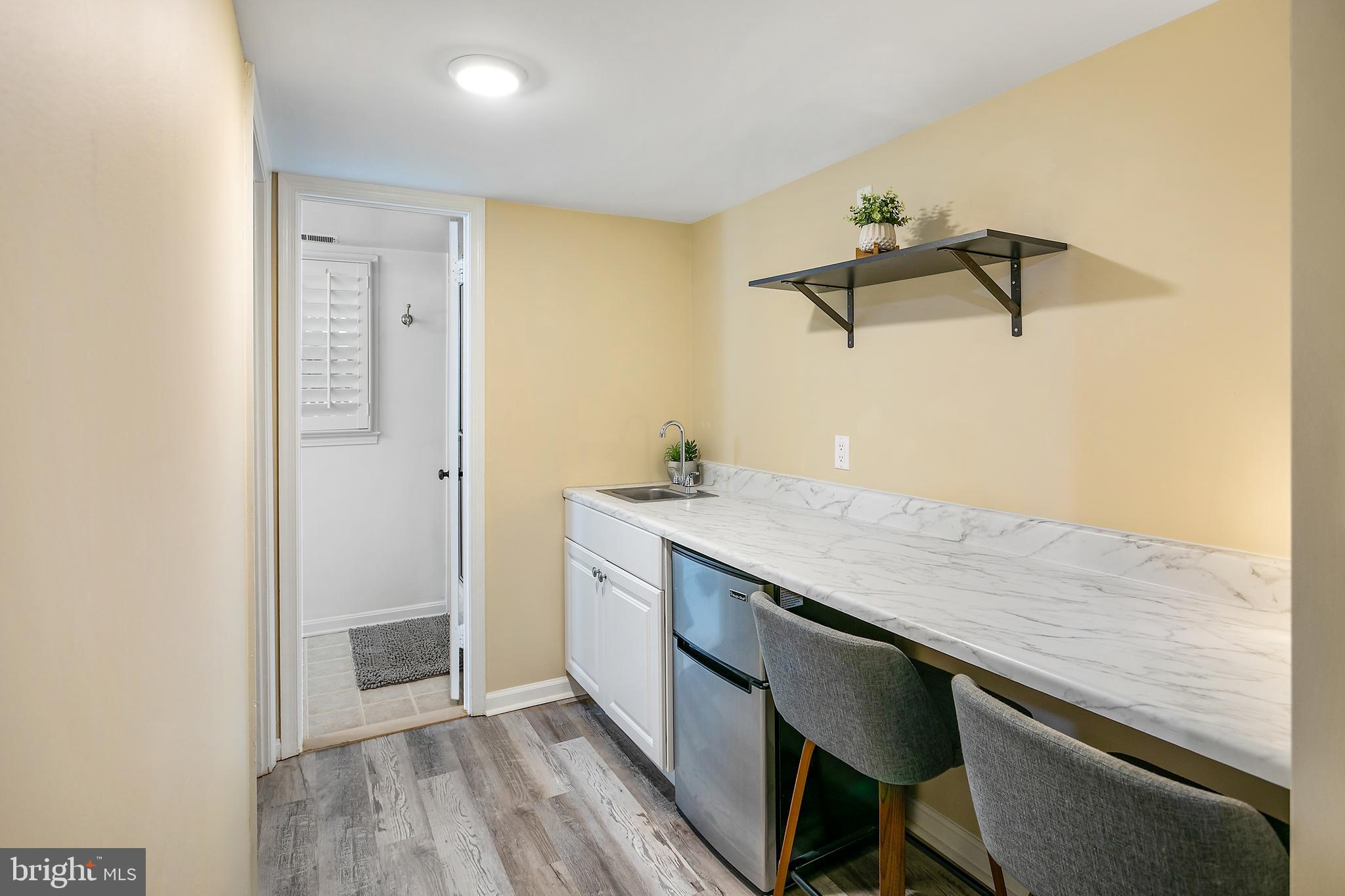 508 Fillmore Street Herndon, VA 20170 - Photo 29 of 39 a hallway with a sink and dishwasher