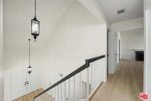a view of a hallway with closet