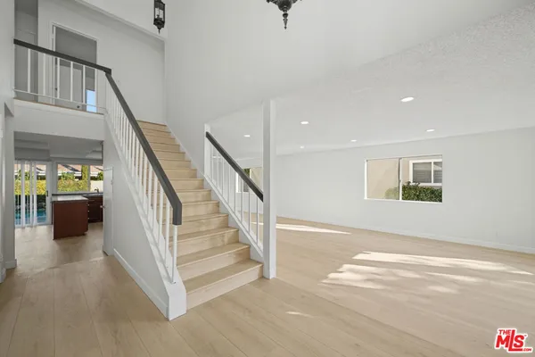 a view of a hallway with staircase