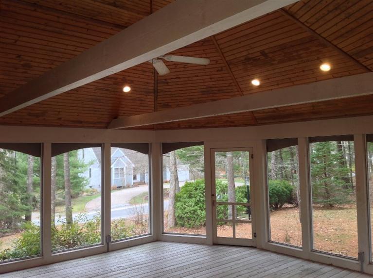 82 Pine Ridge Road Cotuit, MA 02635 - Photo 12 of 14 a big room with wooden floor and outdoor space