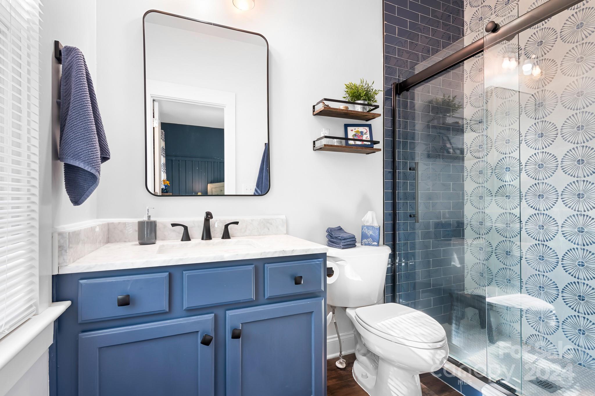 2607 Nations Commons Street Fort Mill, SC 29708 - Photo 17 of 40 a bathroom with a toilet sink and mirror