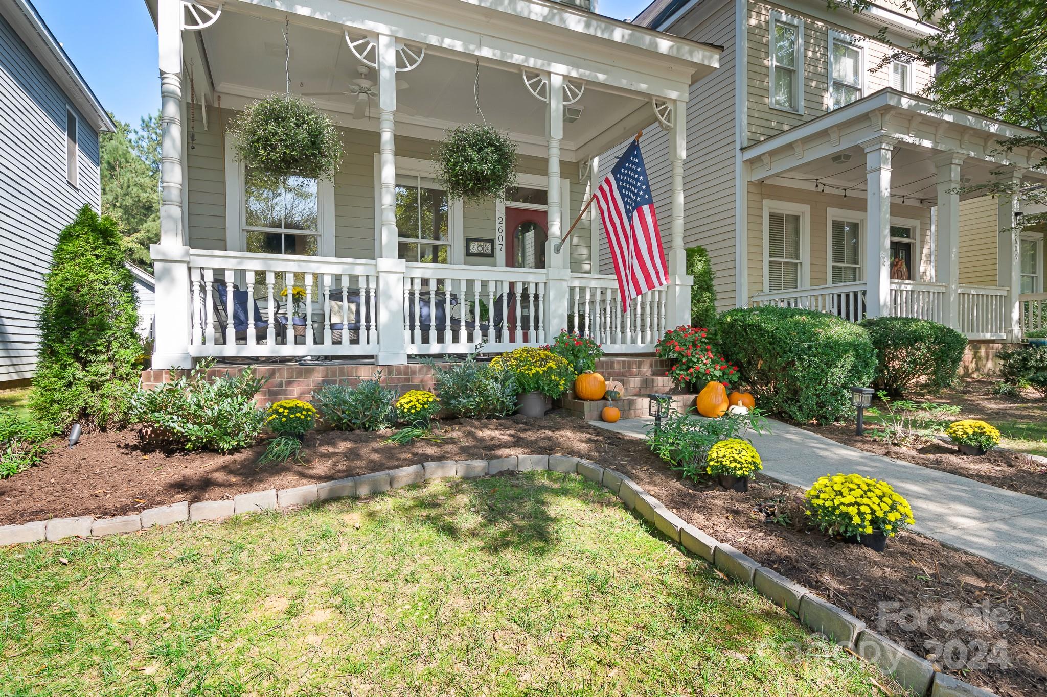 2607 Nations Commons Street Fort Mill, SC 29708 - Photo 3 of 40 a view of a house with a small yard and flower potted plants