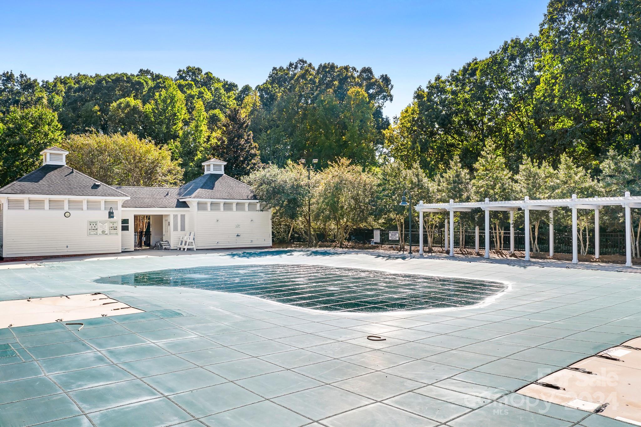 2607 Nations Commons Street Fort Mill, SC 29708 - Photo 38 of 40 a view of a white house with a big yard and large trees