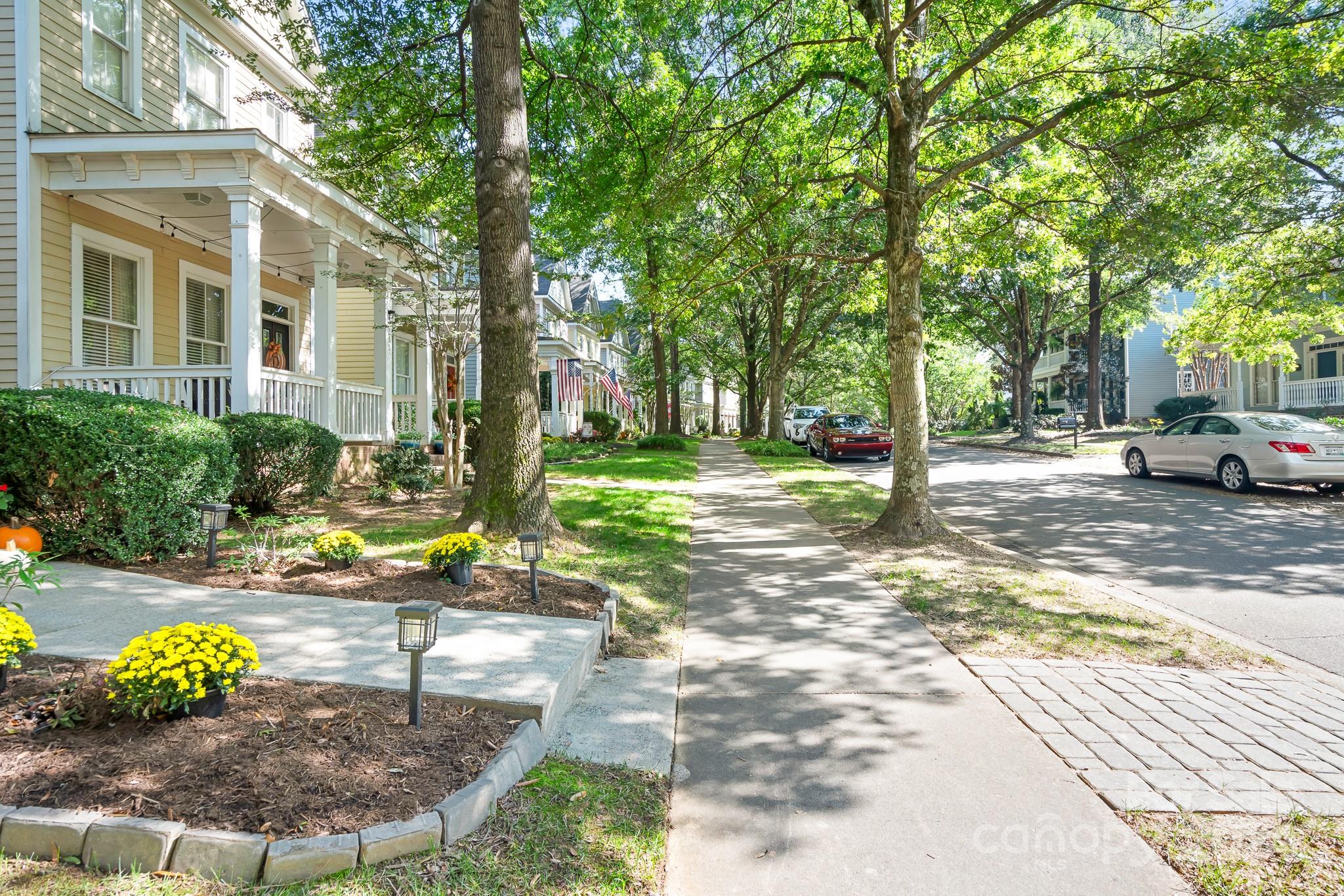 2607 Nations Commons Street Fort Mill, SC 29708 - Photo 4 of 40 a view of a park with lawn chairs and a fire pit