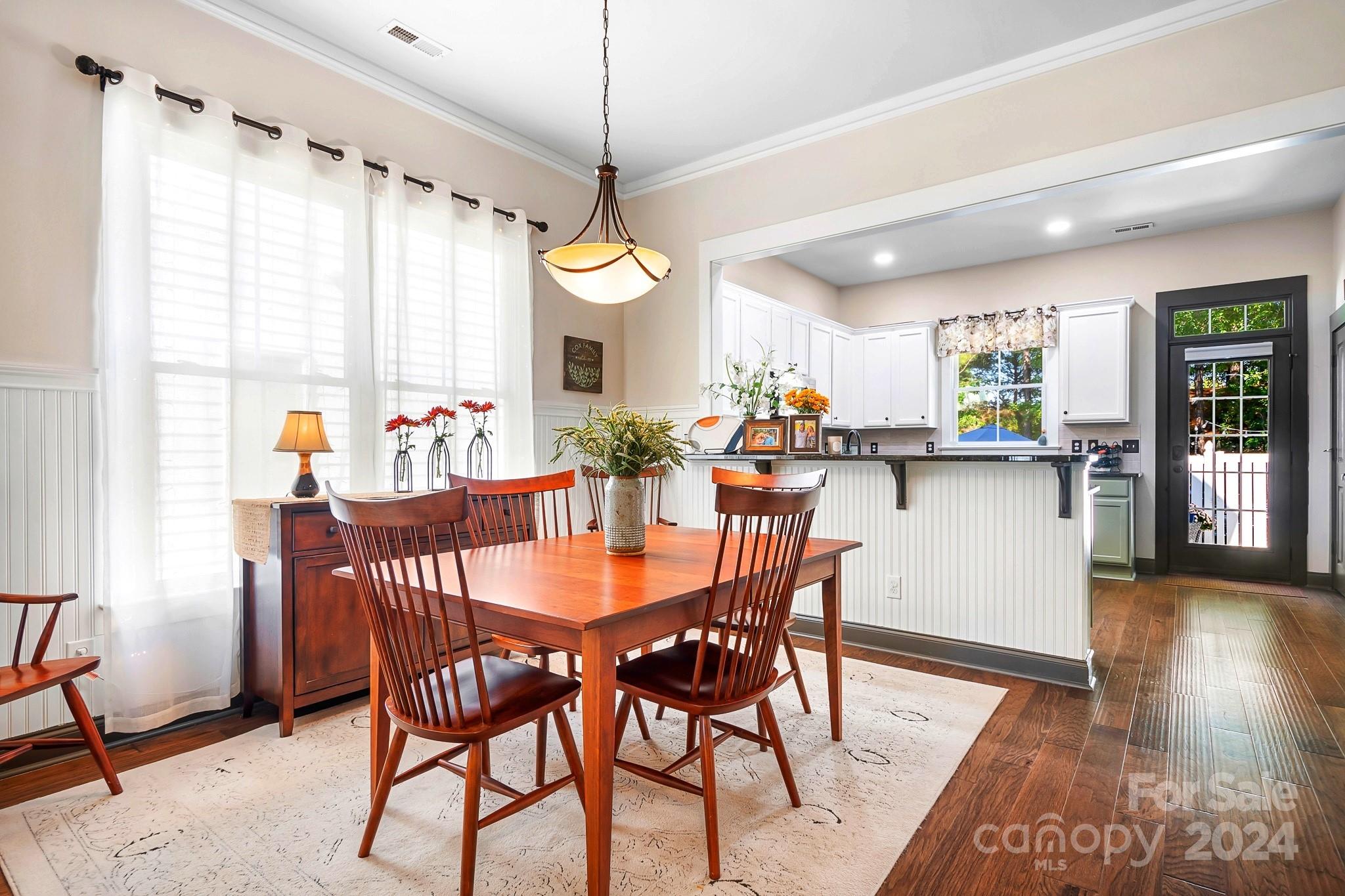 2607 Nations Commons Street Fort Mill, SC 29708 - Photo 9 of 40 a view of a dining room with furniture window and wooden floor