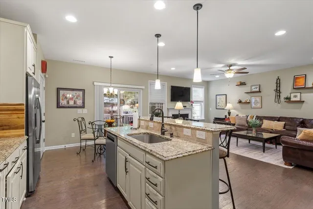 a bedroom with a bed couch and window