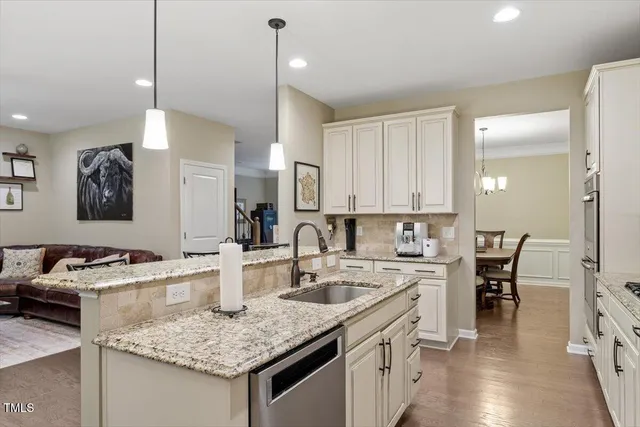 a bathroom with a tub a sink and mirror