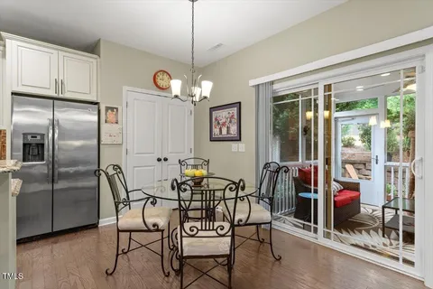 a bathroom with a granite countertop toilet a sink and a mirror