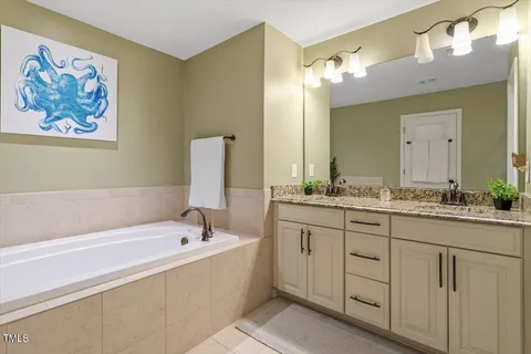 a view of a backyard with lawn chairs and a fire pit