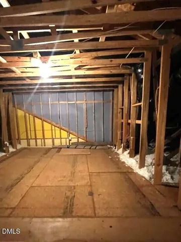 a view of a livingroom with furniture and an entryway