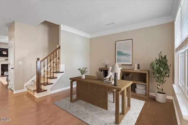 a dining room with furniture and a chandelier