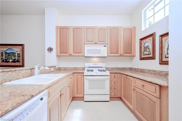 a bed room with a bed and a chandelier