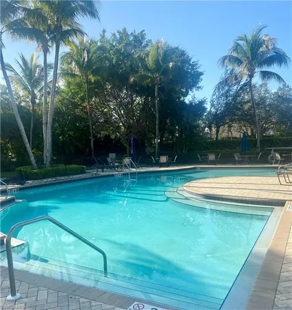 a view of swimming pool with a yard