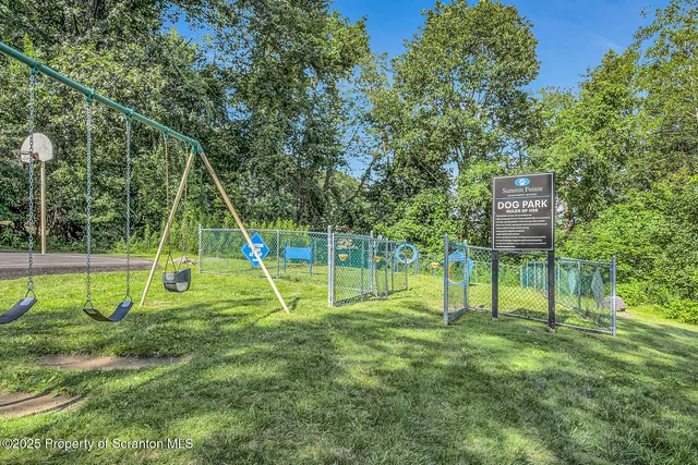 a view of a park with a slide