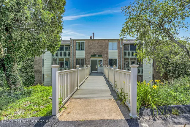 a view of a house with backyard and garden