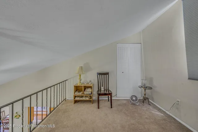 a view of an empty room with stairs