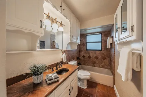 a bathroom with a sink a toilet and a bathtub