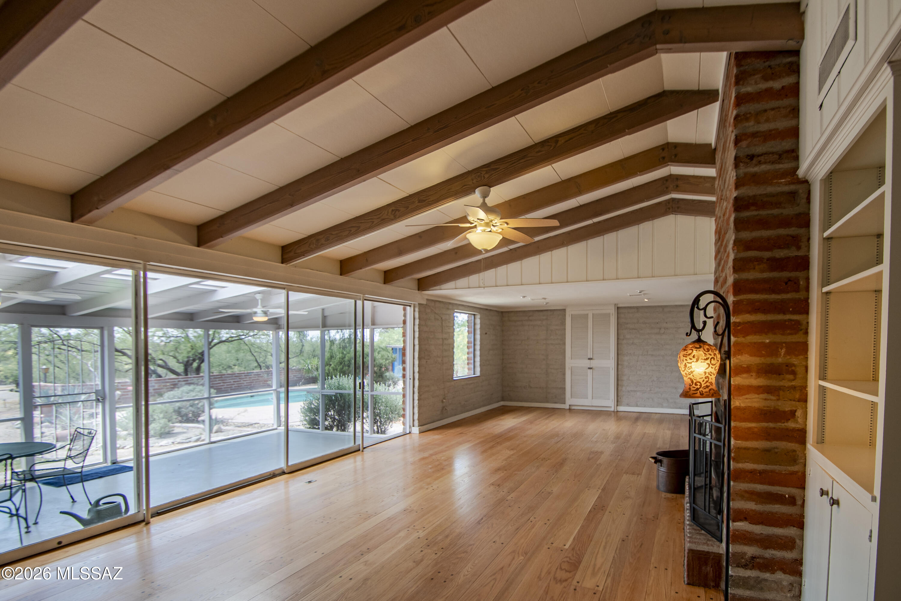 4130 East River Road Tucson, AZ 85718 - Photo 4 of 46 a view of a room with wooden floor and iron stairs